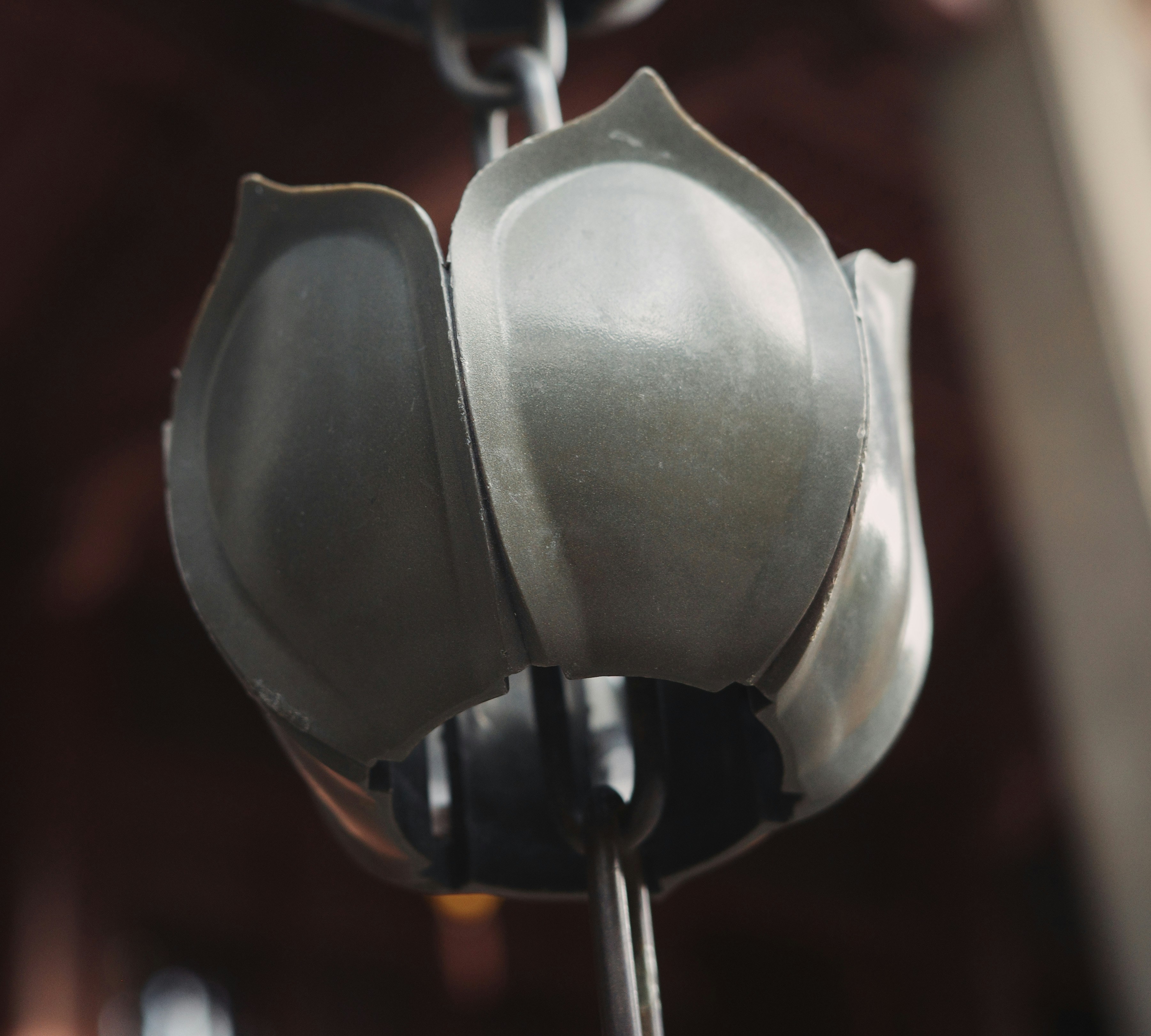 a close up of a metal object with a light on it